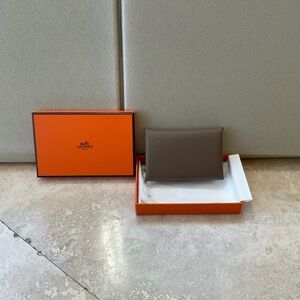 New, in box, authentic Hermes calvi card holder in Etoupe